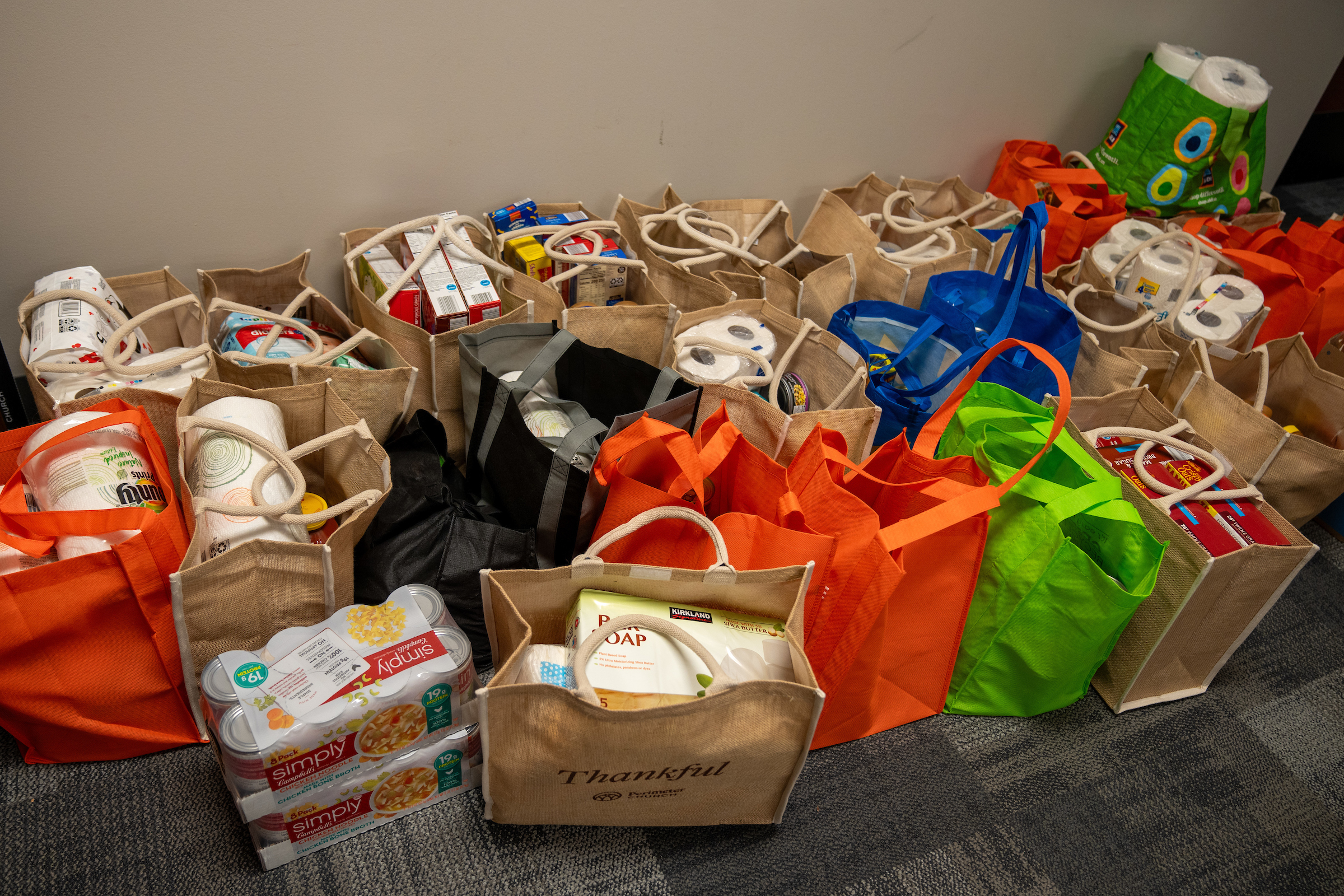 Multiple bags of food drive donations