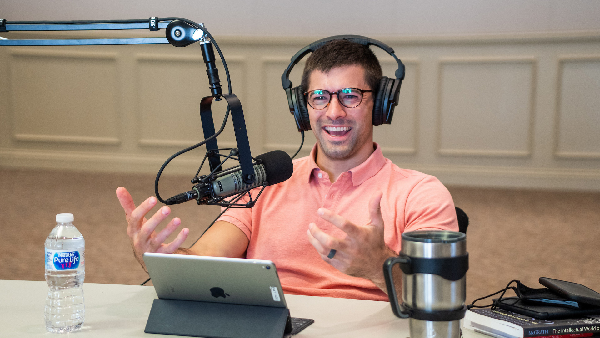 Teacher Caleb Click recording the Digging Deeper podcast