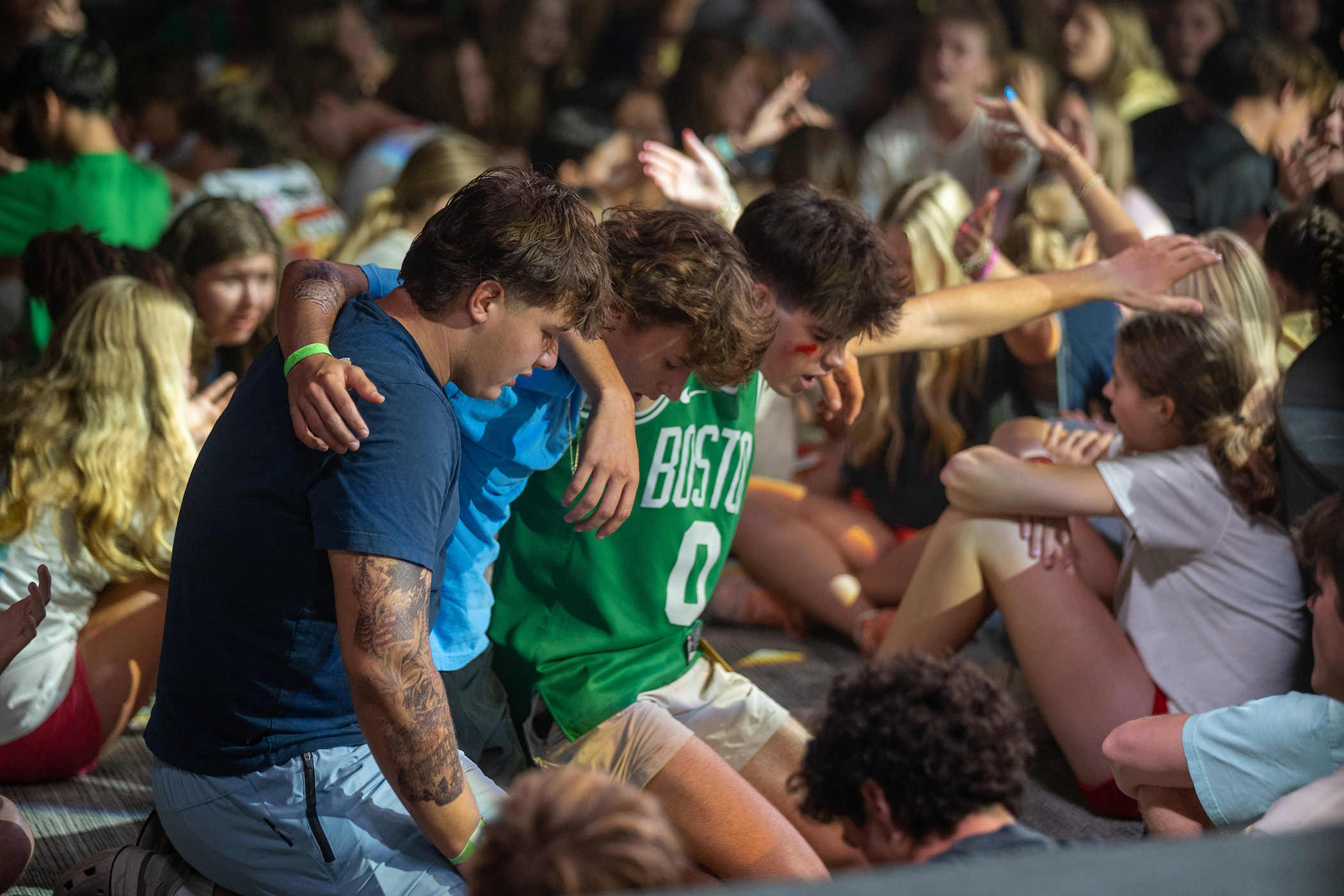 High school boys engaging in the concert of prayer at Rush