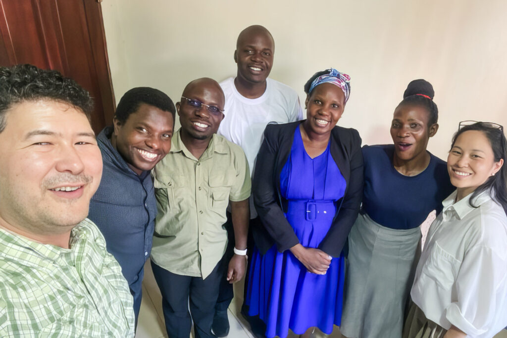 Simon Cole, his wife Andrea, and a group of discipleship leaders in Uganda