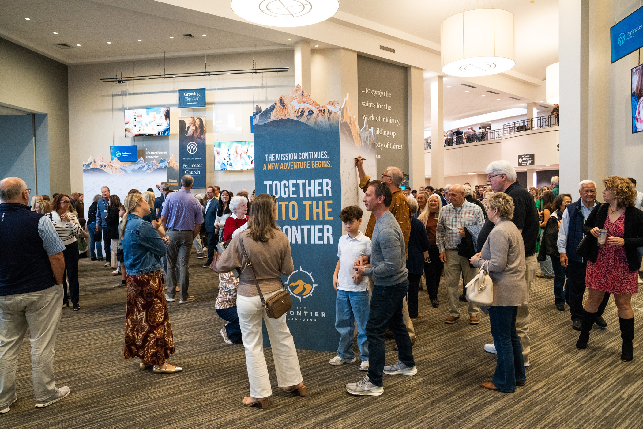 Perimeter members sign the commitment wall on Pledge Sunday