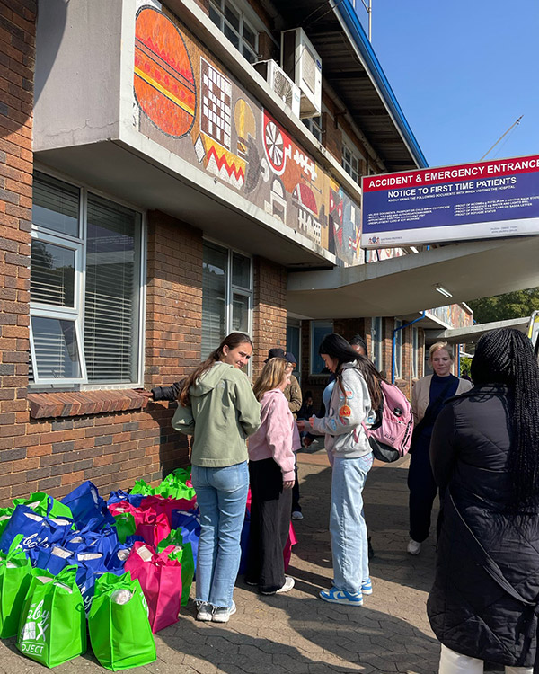 After packing "Baby Boxes," the team visited government hospitals to meet with new moms, offering them the boxes filled with a month supply of baby items, encouraging them, and praying with them.