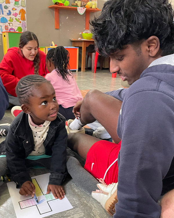 Through coloring, conversation, songs, and games, the team shared the love of Christ with local school children.